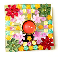 Artificial Rangoli and Diya having flower design